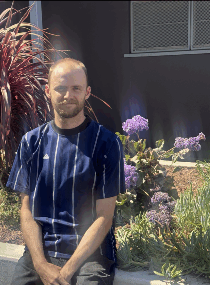 Mr. Carlisle, stopping to smell the flowers.