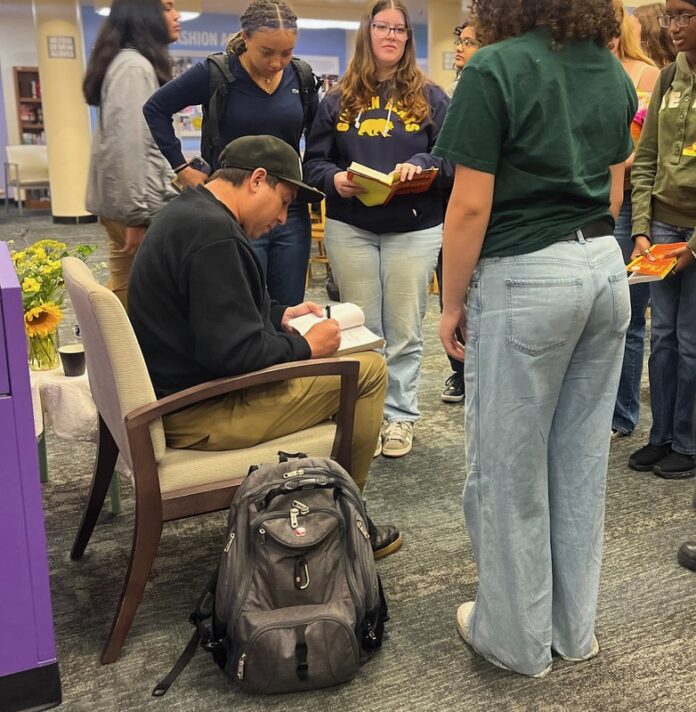 Students gather excitedly for book signings by Tommy Orange